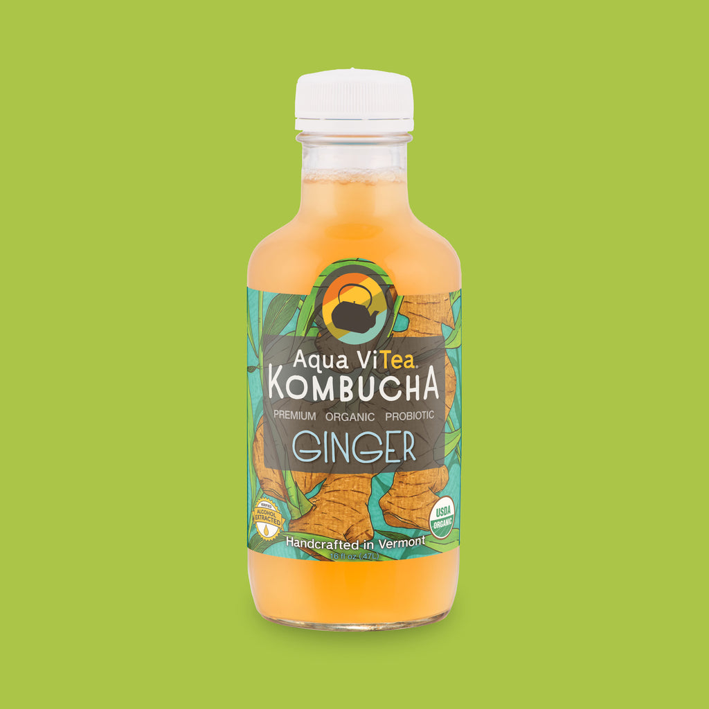 Ginger kombucha bottle on bright green background