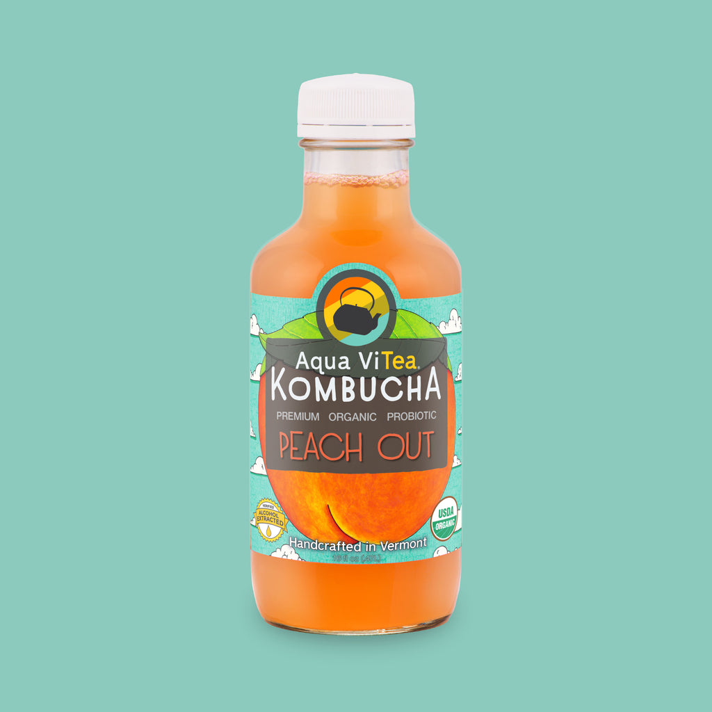 Peach Out kombucha bottle on teal background